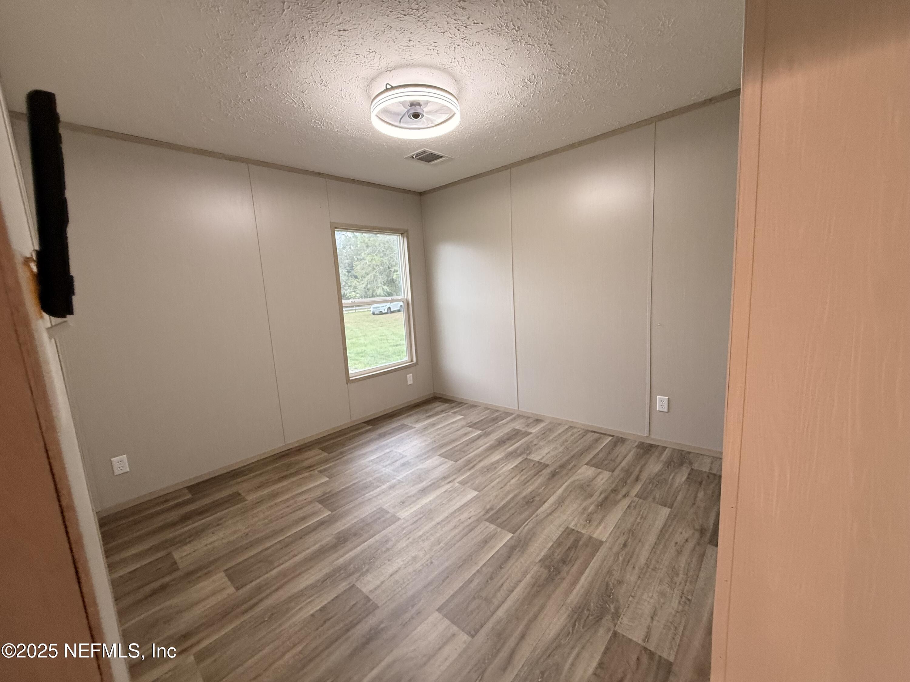 2355 Walters Road Middleburg, FL 32068 - Photo 19 of 63 an empty room with windows