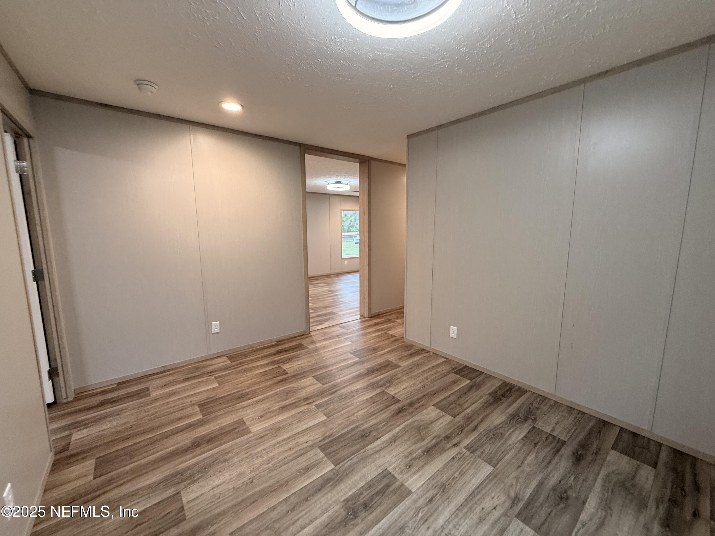 2355 Walters Road Middleburg, FL 32068 - Photo 28 of 63 a view of an empty room and wooden floor