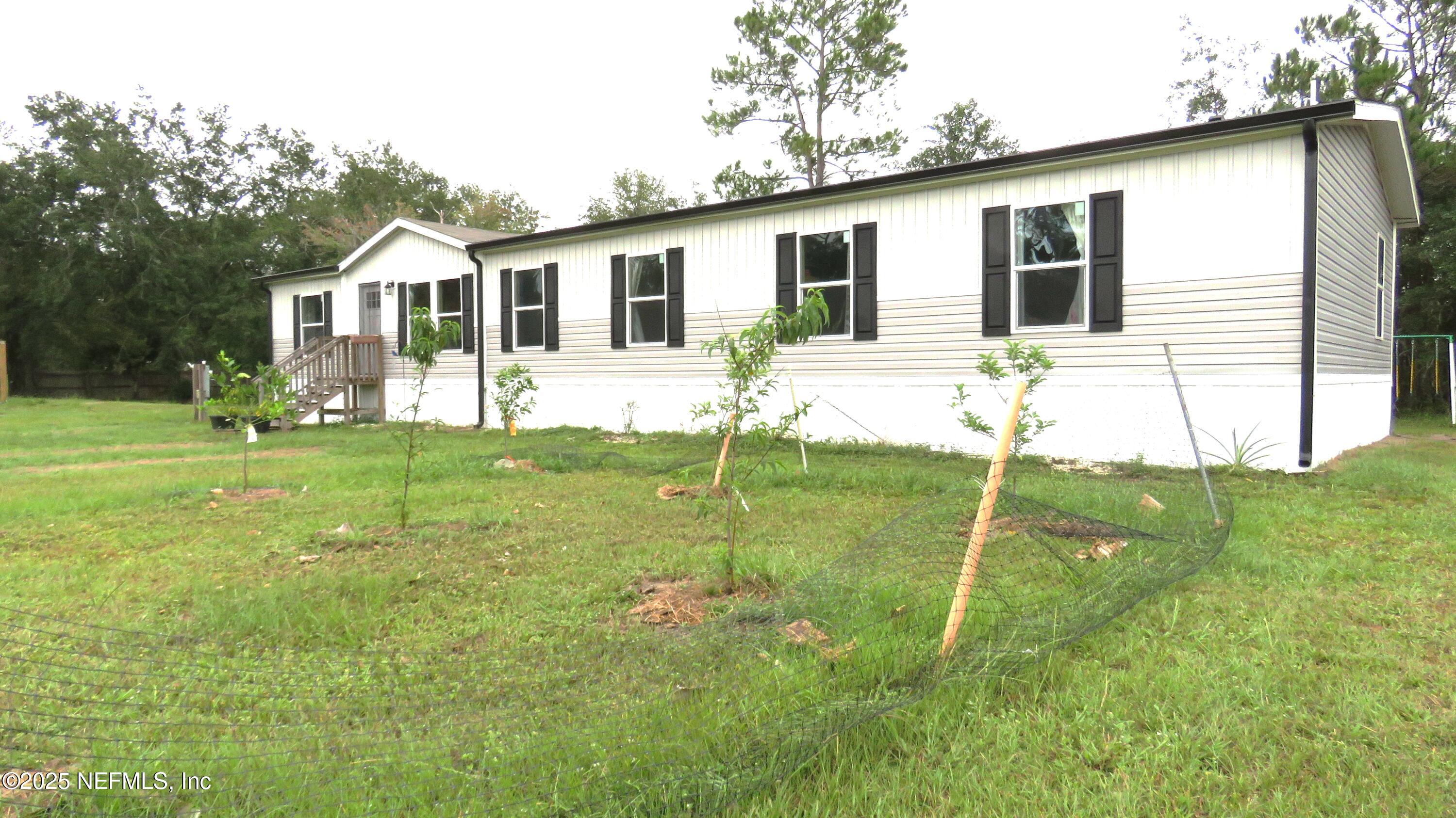 2355 Walters Road Middleburg, FL 32068 - Photo 53 of 63 a view of a house with a backyard