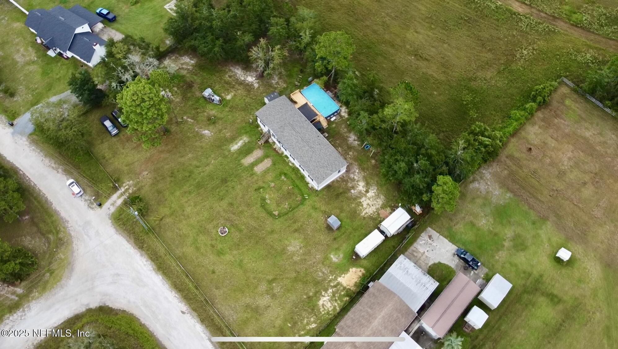2355 Walters Road Middleburg, FL 32068 - Photo 58 of 63 an aerial view of a house with pool yard and outdoor seating