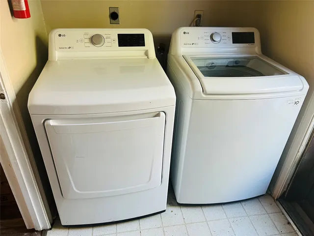 a utility room with dryer and washer