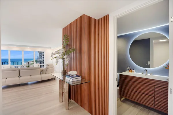 a view of bathroom with a sink and a mirror
