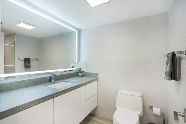 a spacious bedroom with a large bed and a window