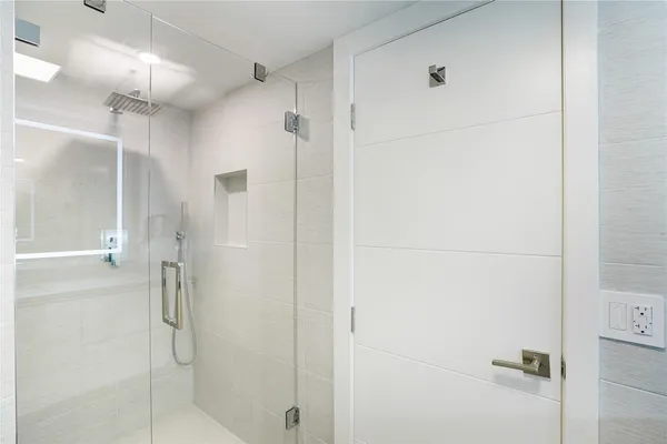 a bedroom with a bed and a chair