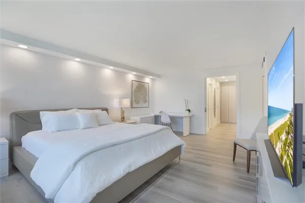 a spacious bathroom with a double vanity sink and mirror