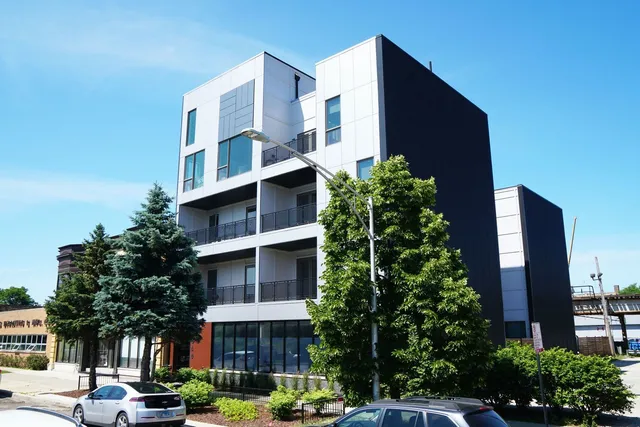 a front view of a building with garden