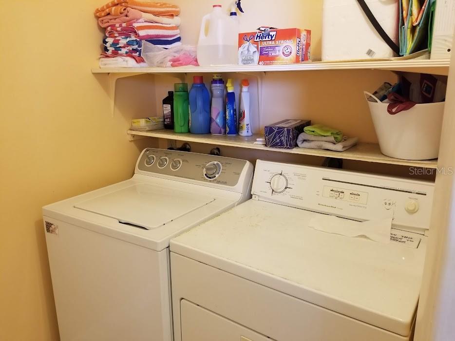 13650 Gulf Boulevard, Unit 304 Madeira Beach, FL 33708 - Photo 58 of 63 a utility room with dryer and washer