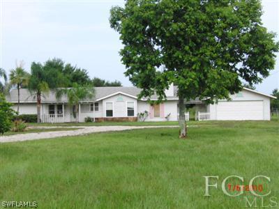 11750 Shawnee Road Fort Myers, FL 33913 - Photo 1 of 10 a front view of house with yard and green space