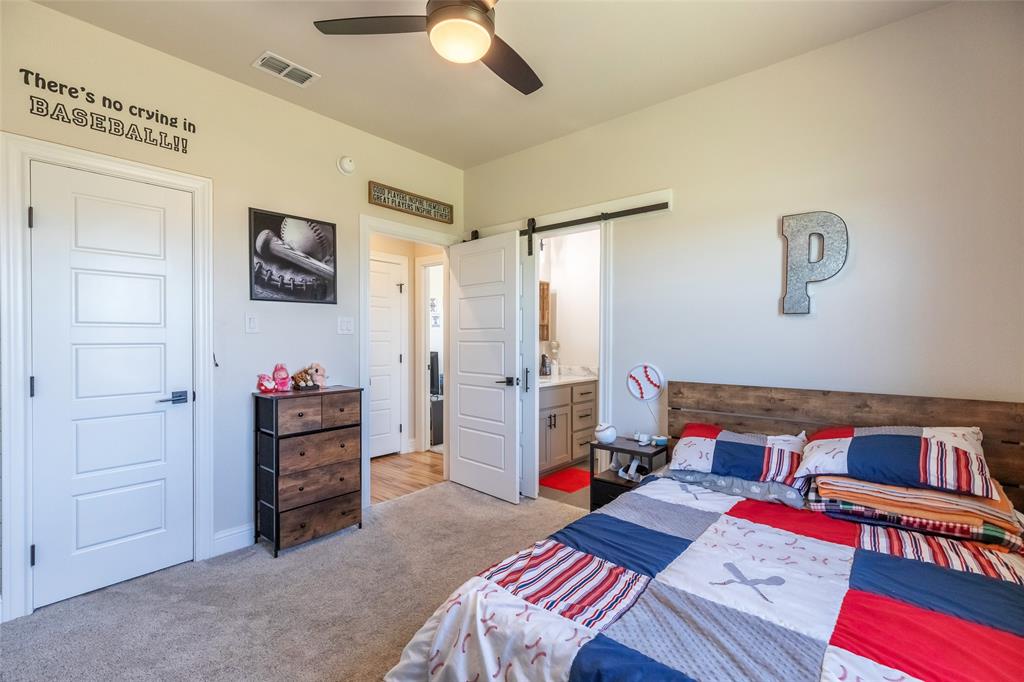 296 Mesquite Ridge Lane Lawn, TX 79530 - Photo 16 of 35 a bedroom with furniture and a flat screen tv