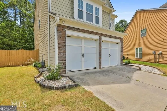 a view of a backyard of the house