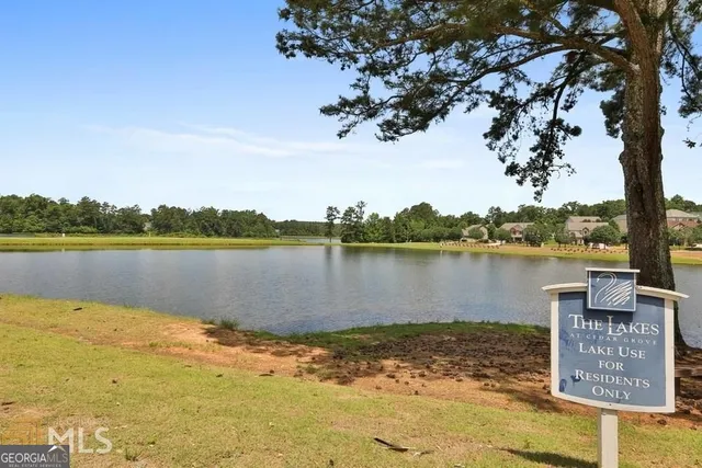 a view of a swimming pool with an outdoor space and seating area