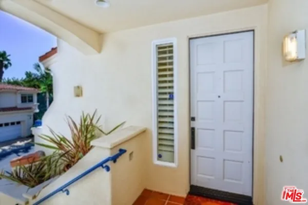 a view of front door and bedroom