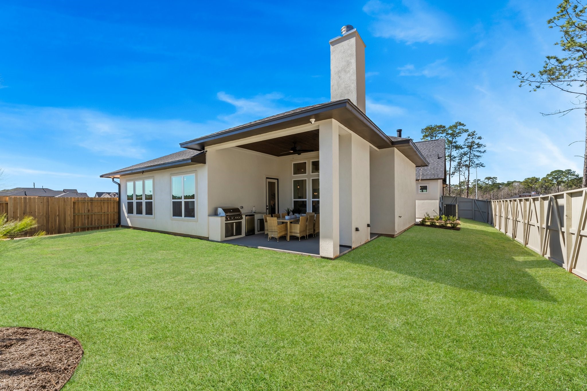 322 Marsh Wren Way Magnolia, TX 77354 - Photo 19 of 19 a view of a house with backyard and porch