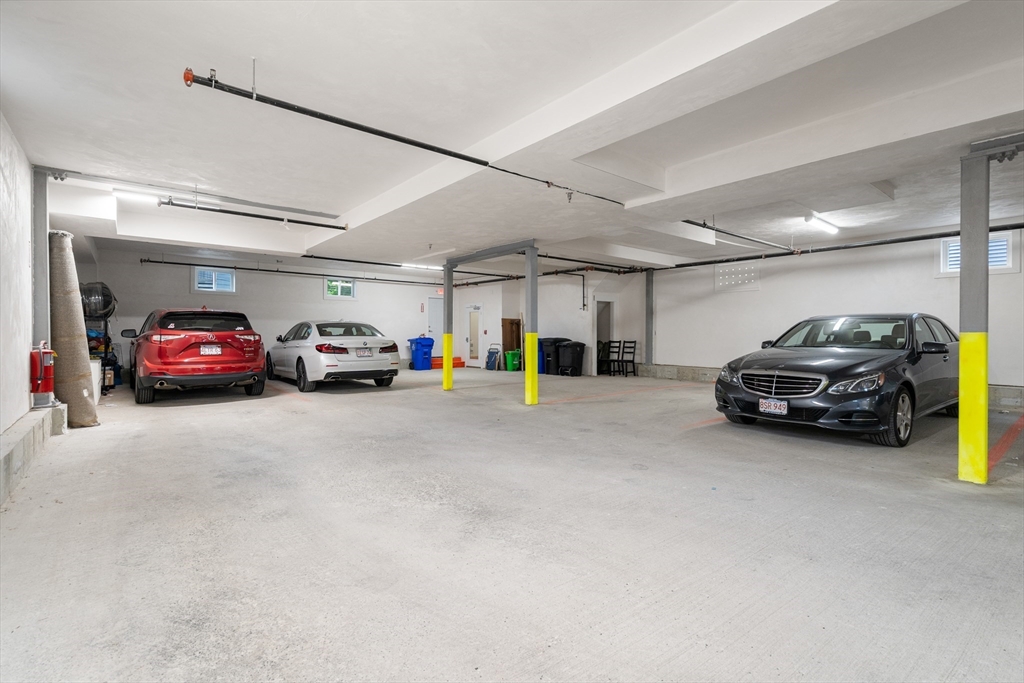 32 Pearl Street, Unit 4 Boston, MA 02125 - Photo 2 of 35 a view of cars parked in a parking