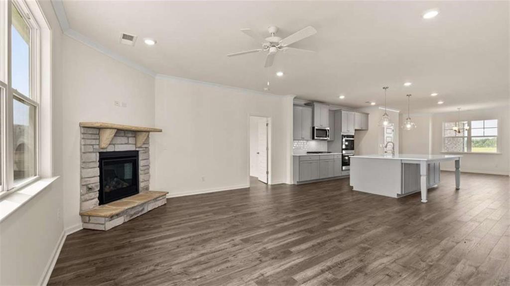 1812 Quaker Street Hampton, GA 30228 - Photo 22 of 53 a view of kitchen with kitchen island wooden floor and refrigerator