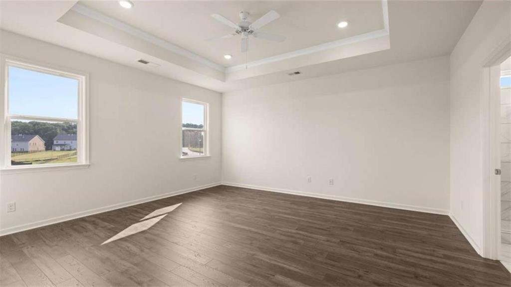 1812 Quaker Street Hampton, GA 30228 - Photo 24 of 53 an empty room with wooden floor and windows