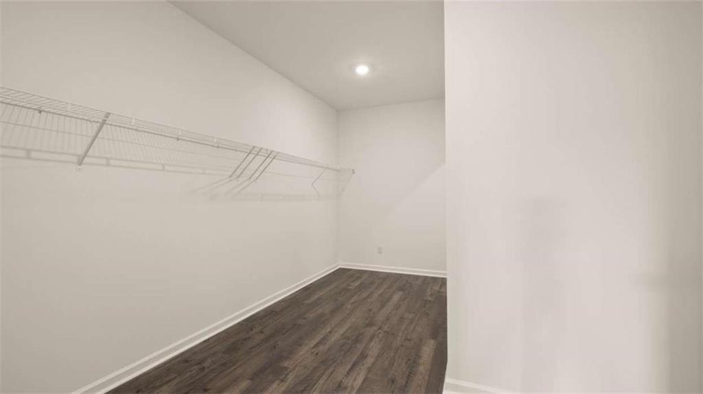 1812 Quaker Street Hampton, GA 30228 - Photo 28 of 53 a view of a room with racks on the wall