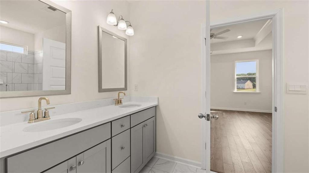1812 Quaker Street Hampton, GA 30228 - Photo 30 of 53 a bathroom with a sink and a mirror