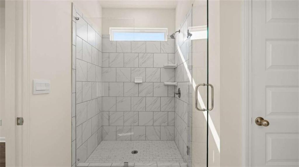 1812 Quaker Street Hampton, GA 30228 - Photo 32 of 53 a bathroom with a shower