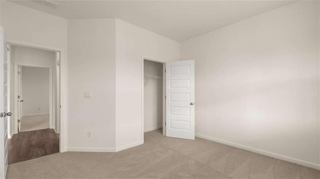 1812 Quaker Street Hampton, GA 30228 - Photo 36 of 53 an empty room with closet and mirror