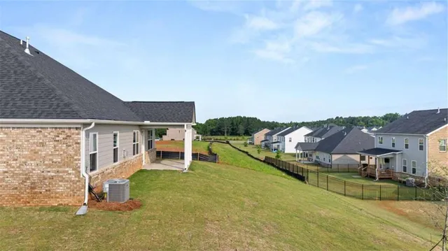 a front view of a house with a yard table and chairs