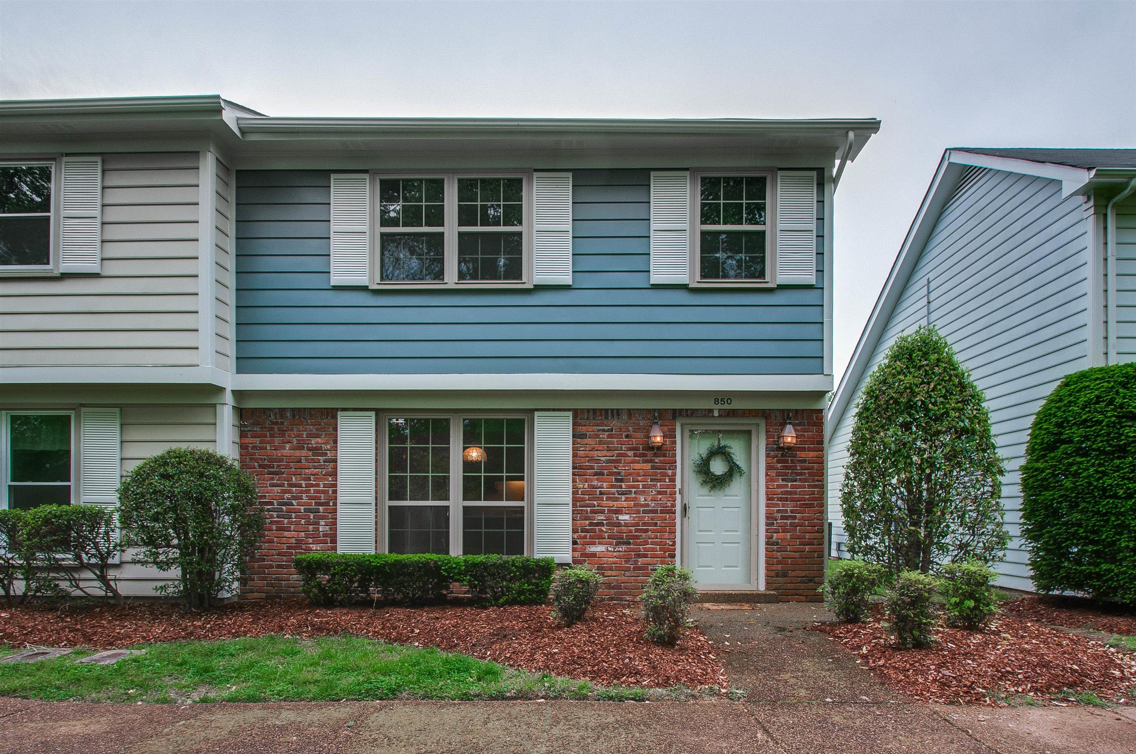 850 General George Patton Road, Unit 850 Nashville, TN 37221 - Photo 1 of 25 a front view of a house with garden