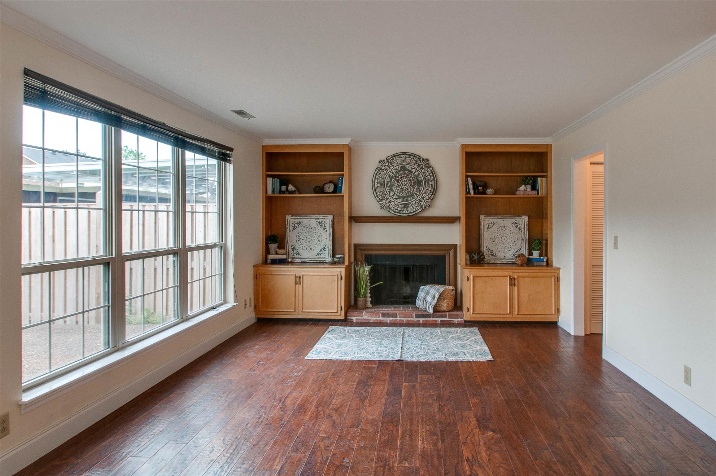 850 General George Patton Road, Unit 850 Nashville, TN 37221 - Photo 5 of 25 a living room with furniture and a fireplace
