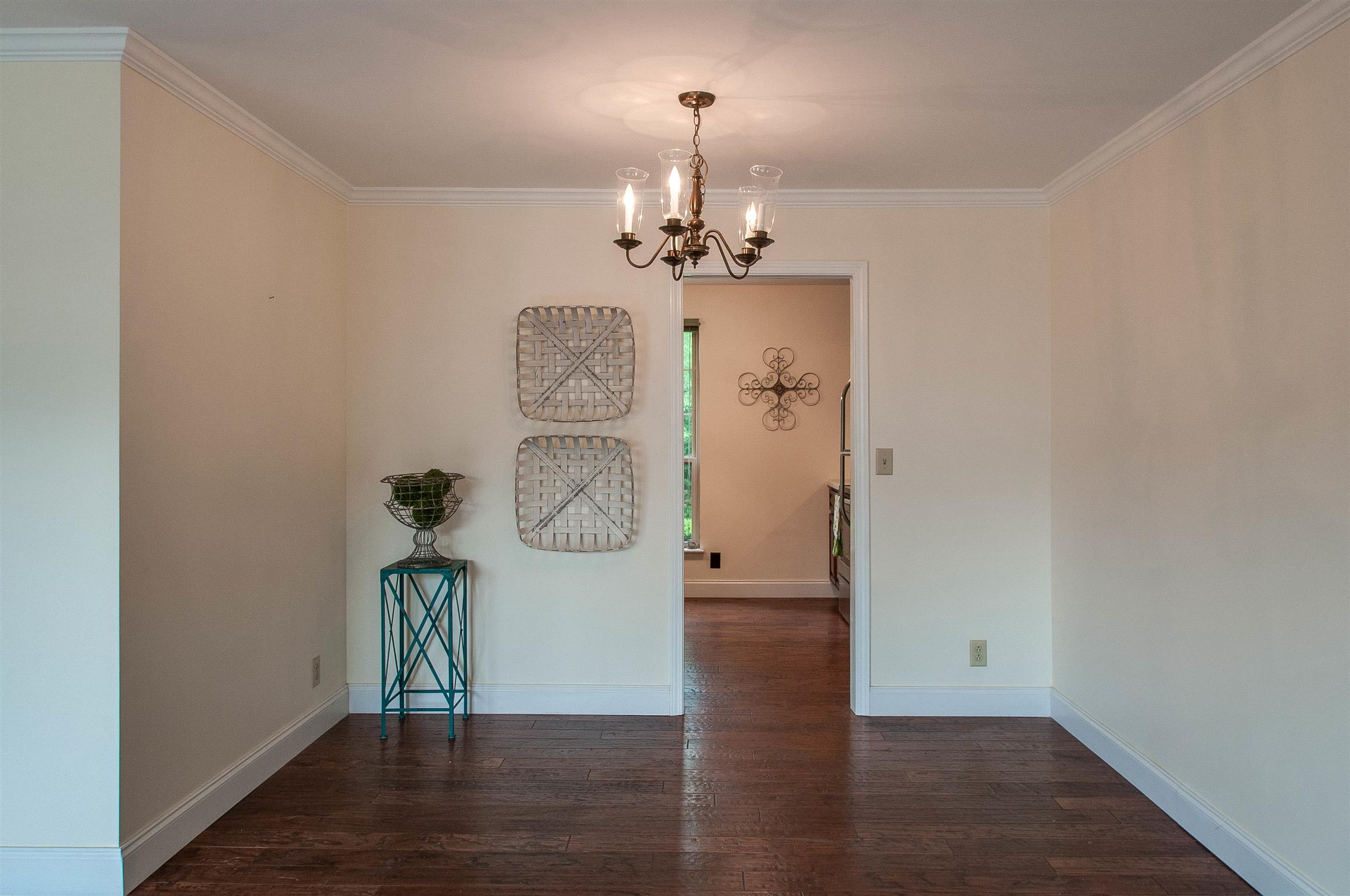 850 General George Patton Road, Unit 850 Nashville, TN 37221 - Photo 8 of 25 a view of a hallway with wooden floor and staircase