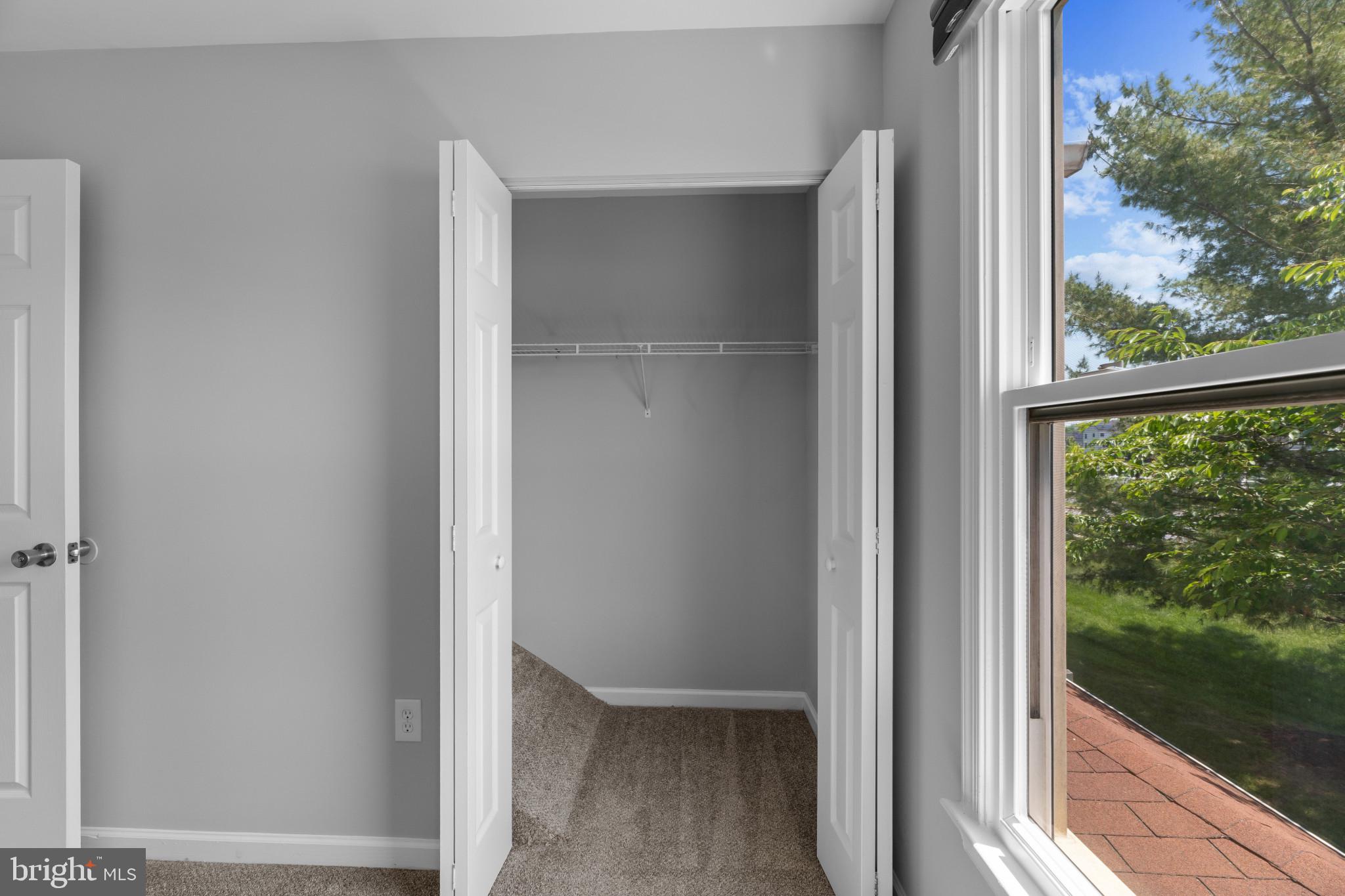 9302 Player Drive, Unit 155 Laurel, MD 20708 - Photo 34 of 43 a view of a glass door and a window