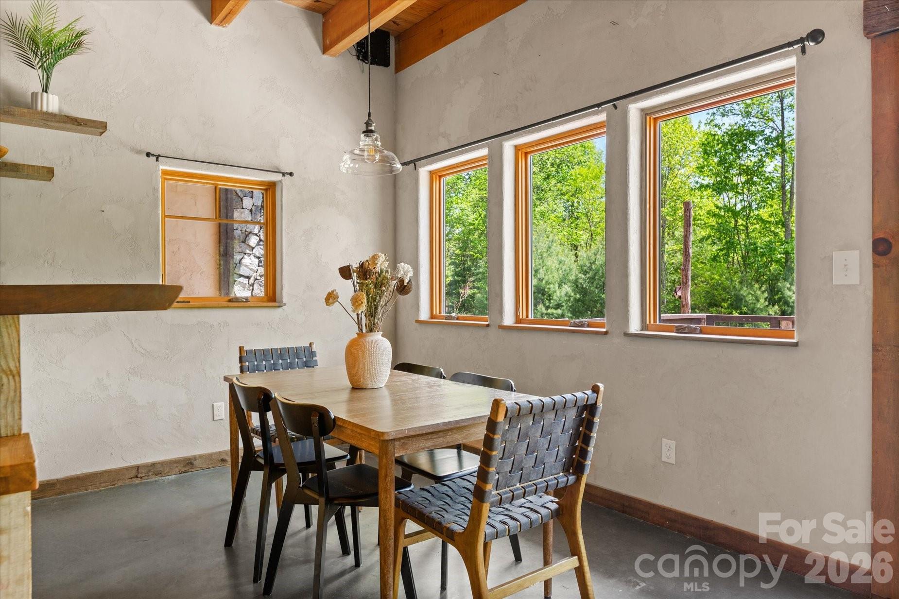 3151 Lumptown Road Marshall, NC 28753 - Photo 19 of 48 a view of a dining room with furniture window and outside view