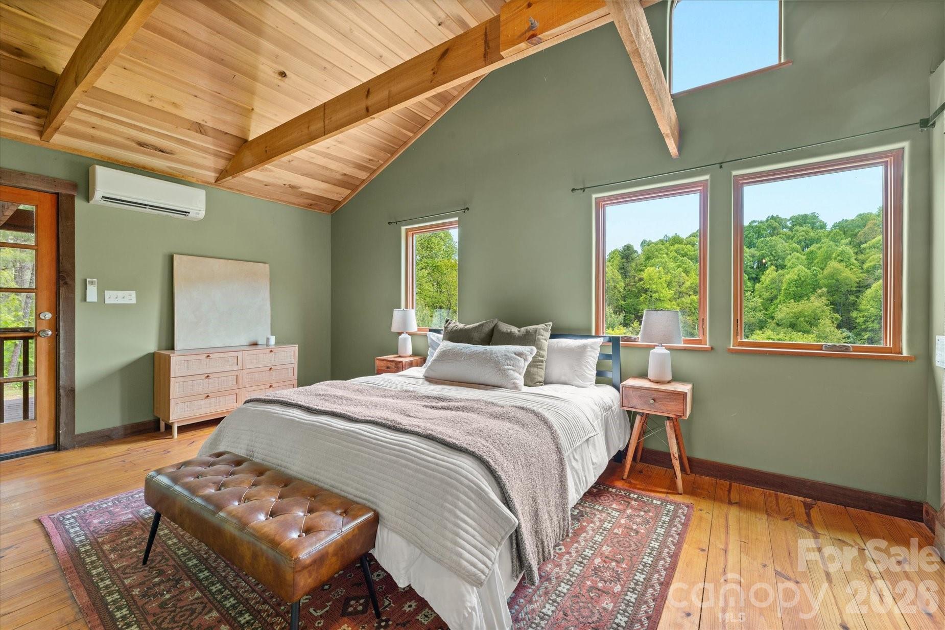 3151 Lumptown Road Marshall, NC 28753 - Photo 24 of 48 a bedroom with a bed window and a table