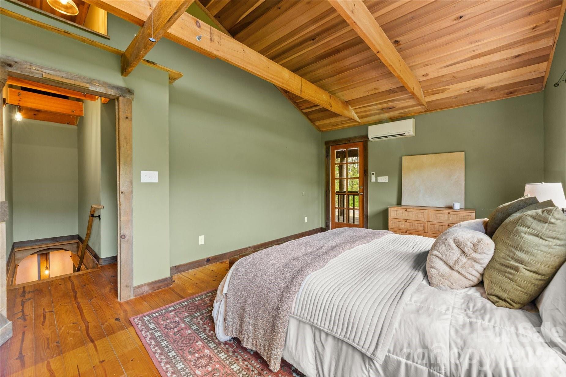 3151 Lumptown Road Marshall, NC 28753 - Photo 25 of 48 a bedroom with a bed and a large window
