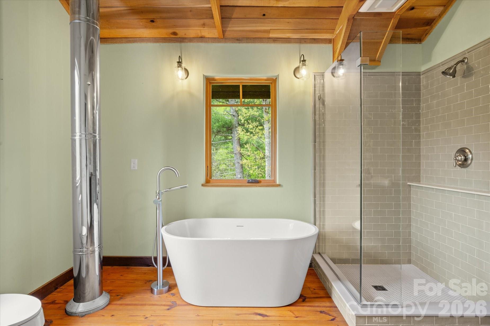 3151 Lumptown Road Marshall, NC 28753 - Photo 28 of 48 a bathroom with a bathtub and shower