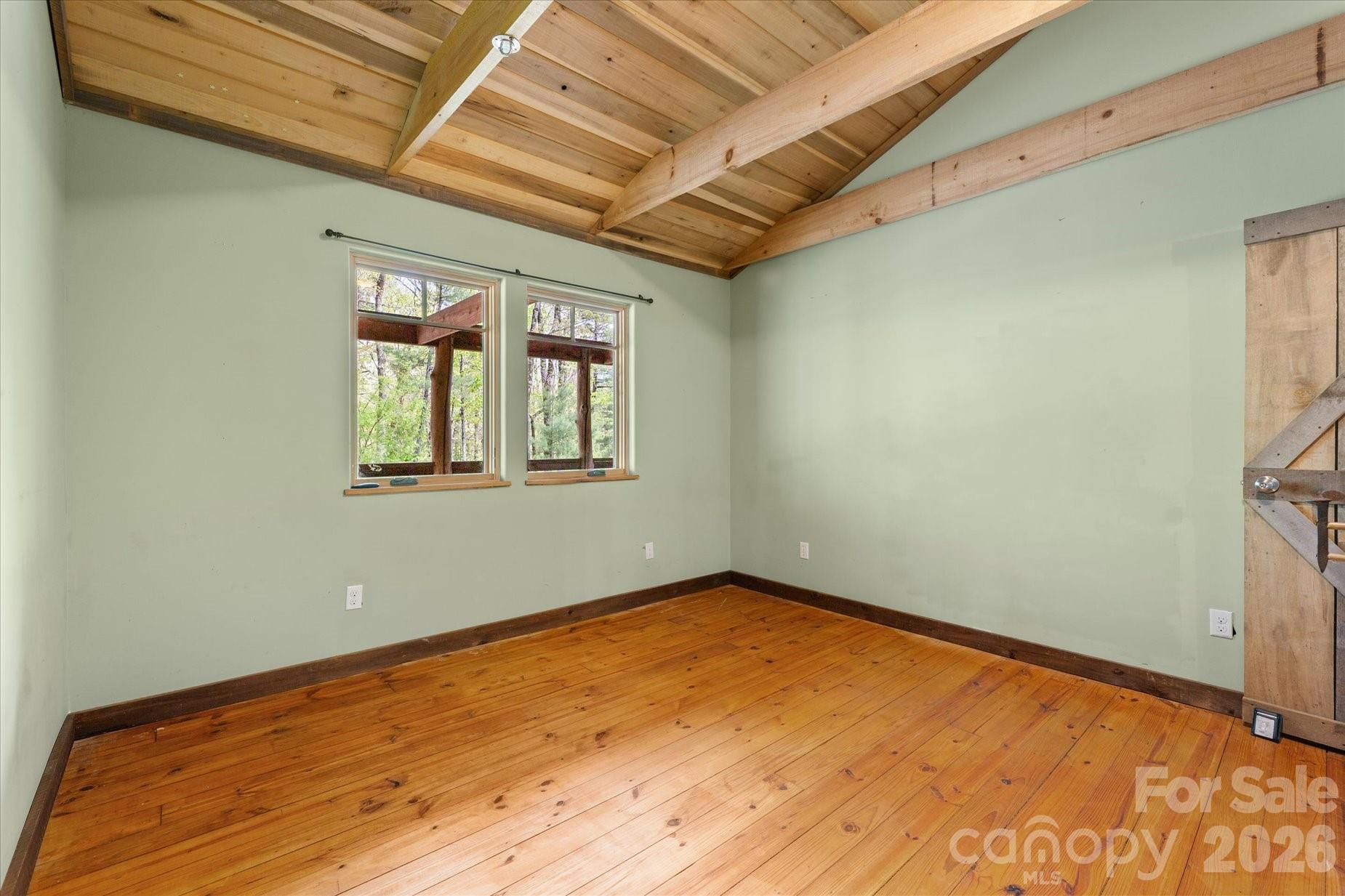 3151 Lumptown Road Marshall, NC 28753 - Photo 34 of 48 a view of empty room with wooden floor and fan