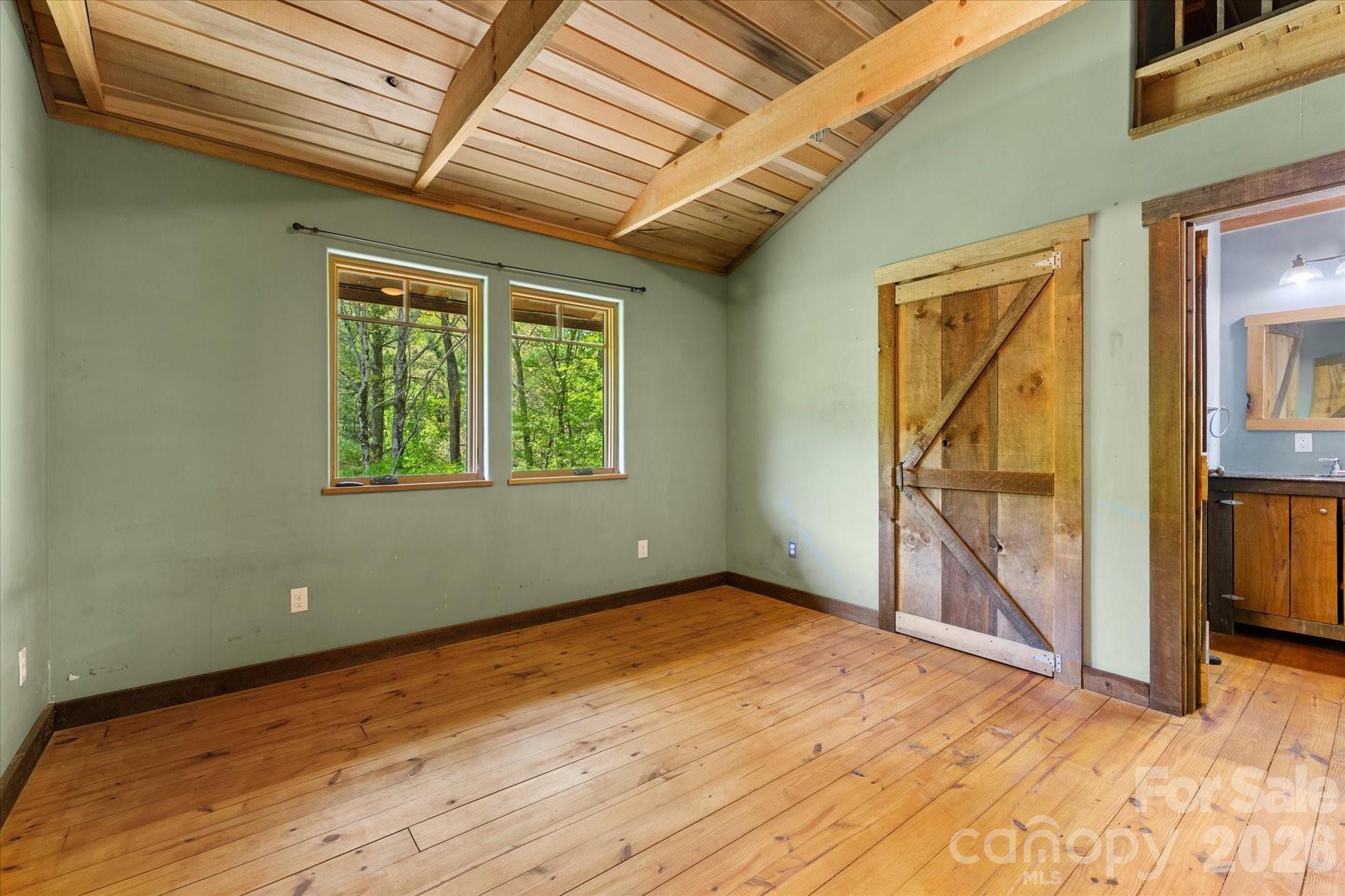 3151 Lumptown Road Marshall, NC 28753 - Photo 35 of 48 a view of an empty room with a window