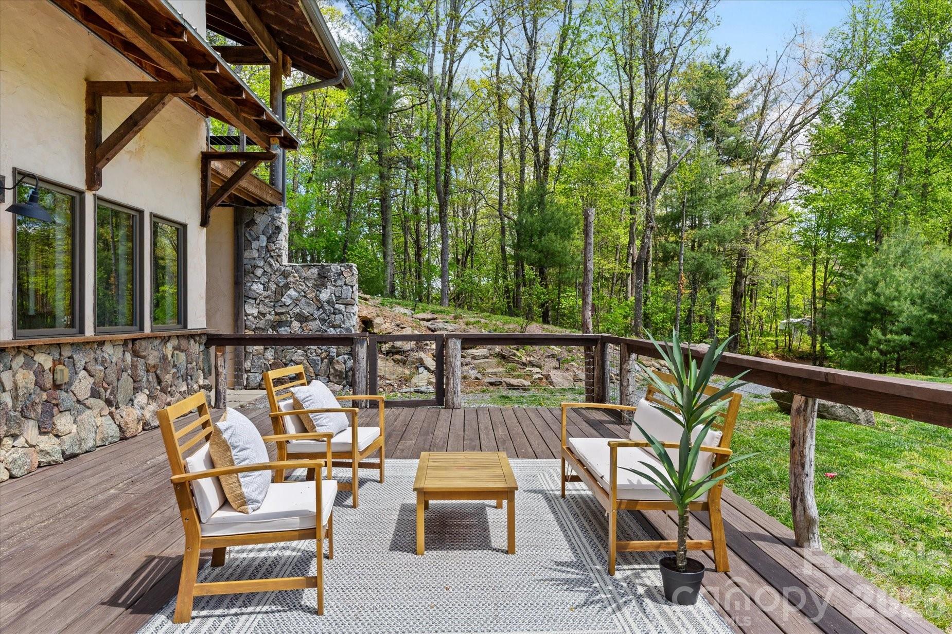 3151 Lumptown Road Marshall, NC 28753 - Photo 5 of 48 a view of a chairs and table in patio