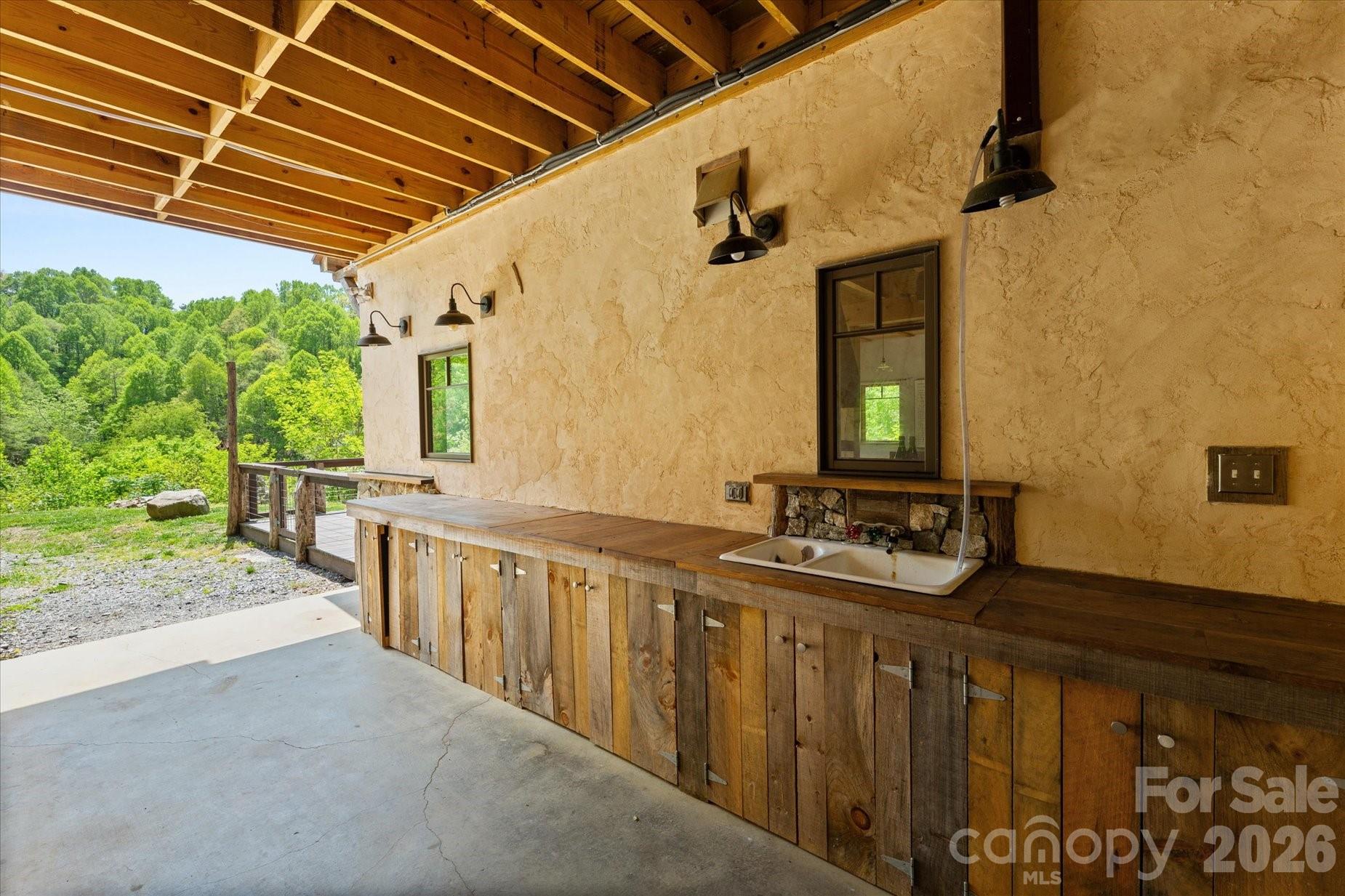 3151 Lumptown Road Marshall, NC 28753 - Photo 6 of 48 a bathroom with sink a mirror and next to a window