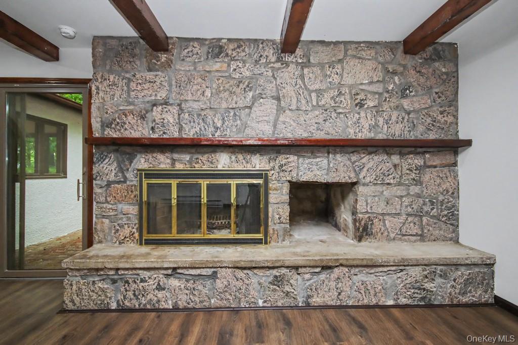 18 Hillside View Road Mahopac, NY 10541 - Photo 20 of 42 a living room with a fireplace and a rug