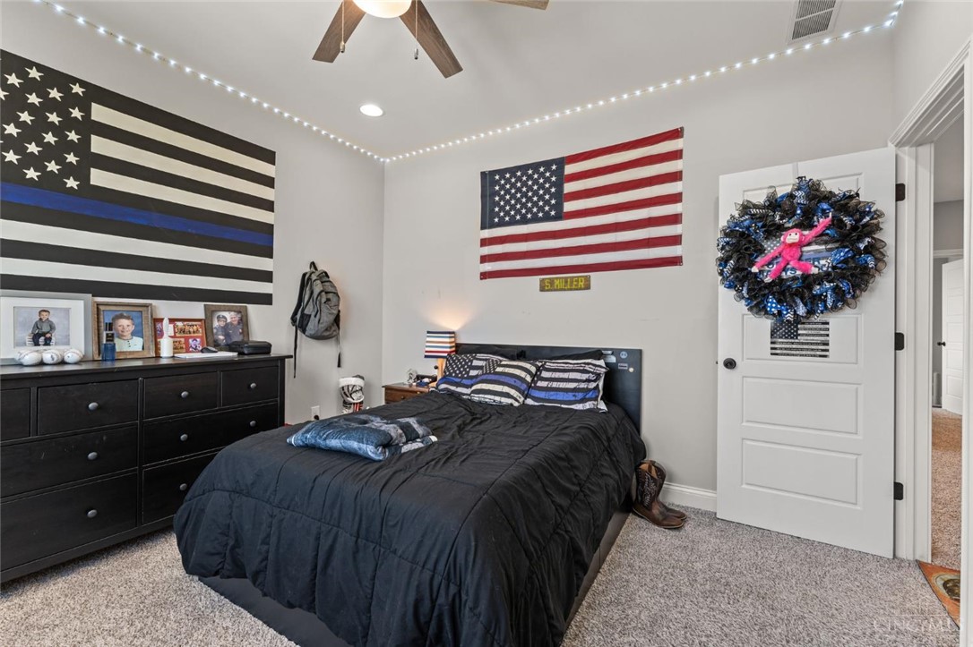 2425 Middleboro Road Clarksville, OH 45113 - Photo 78 of 91 This cozy bedroom features plush carpeting and a bright ceiling fan.