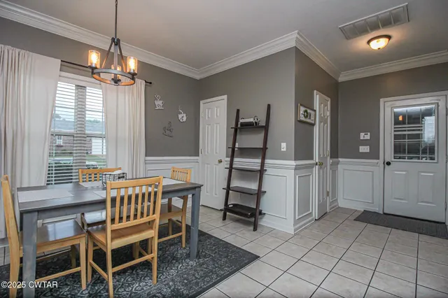 a dining room with furniture and window