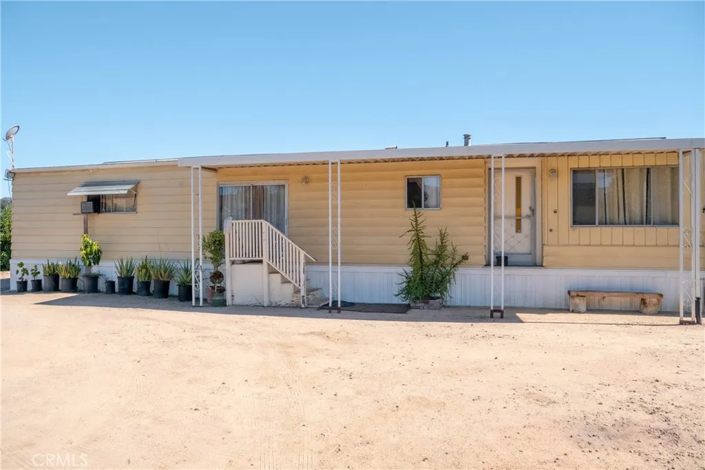39238 Daily Fallbrook, CA 92028 - Photo 14 of 16 a front view of a house with a yard
