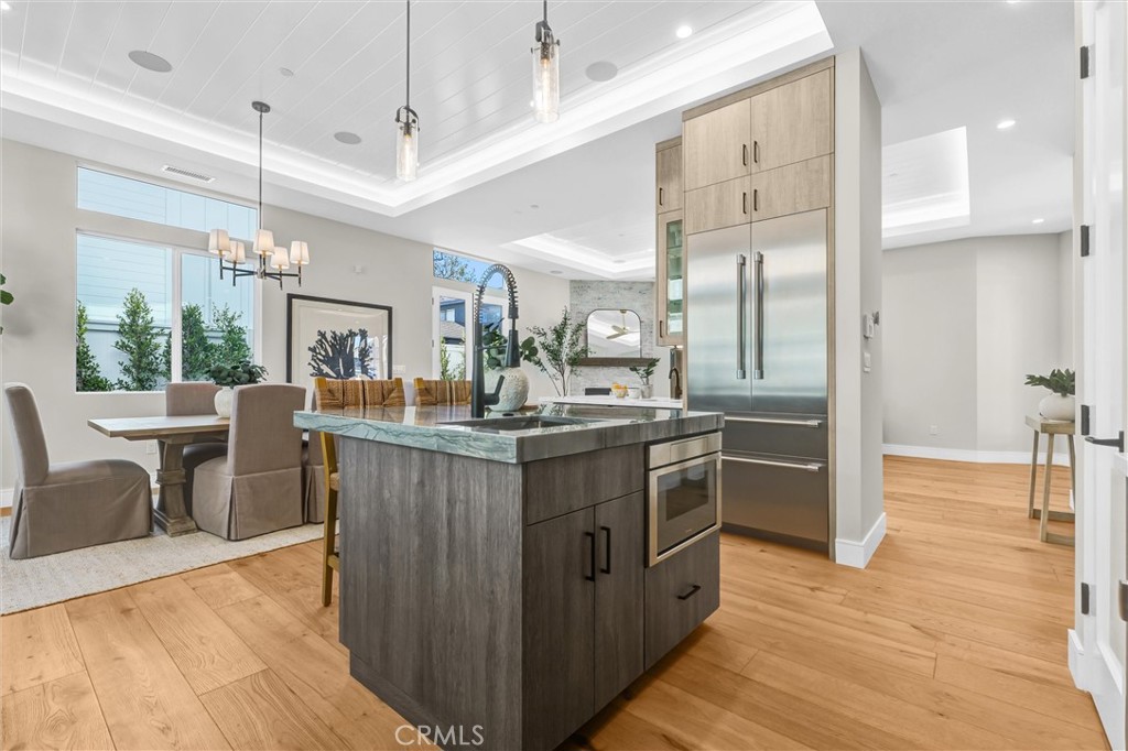 2016 Farrell Avenue, Unit A Redondo Beach, CA 90278 - Photo 11 of 42 a kitchen with stainless steel appliances granite countertop a sink a stove and a wooden floors