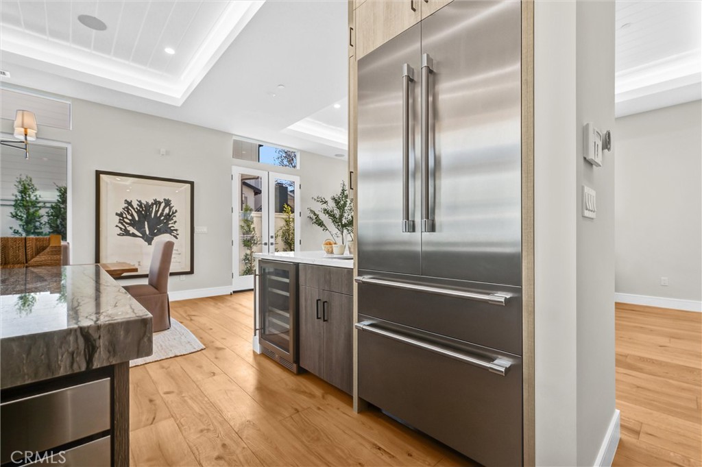 2016 Farrell Avenue, Unit A Redondo Beach, CA 90278 - Photo 12 of 42 a kitchen with granite countertop a refrigerator and a stove top oven