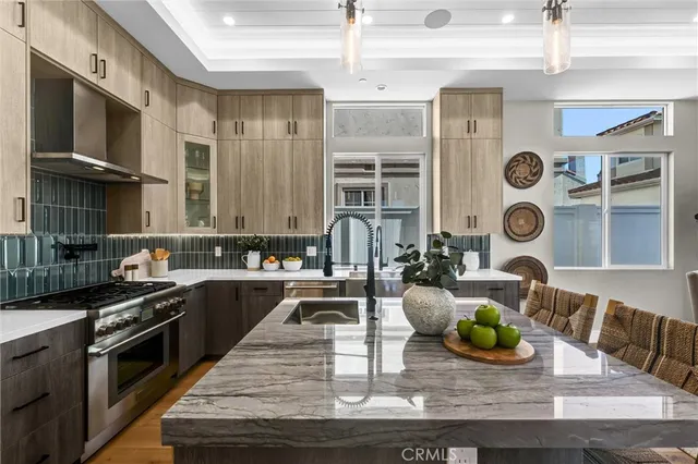 a kitchen with granite countertop a sink and stove
