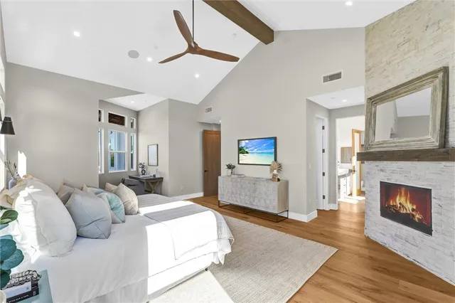 a bed room with furniture and a fireplace