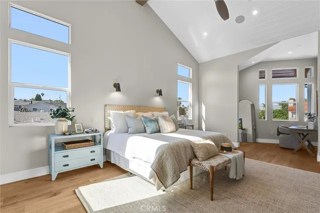 a bedroom with a bed and a couch