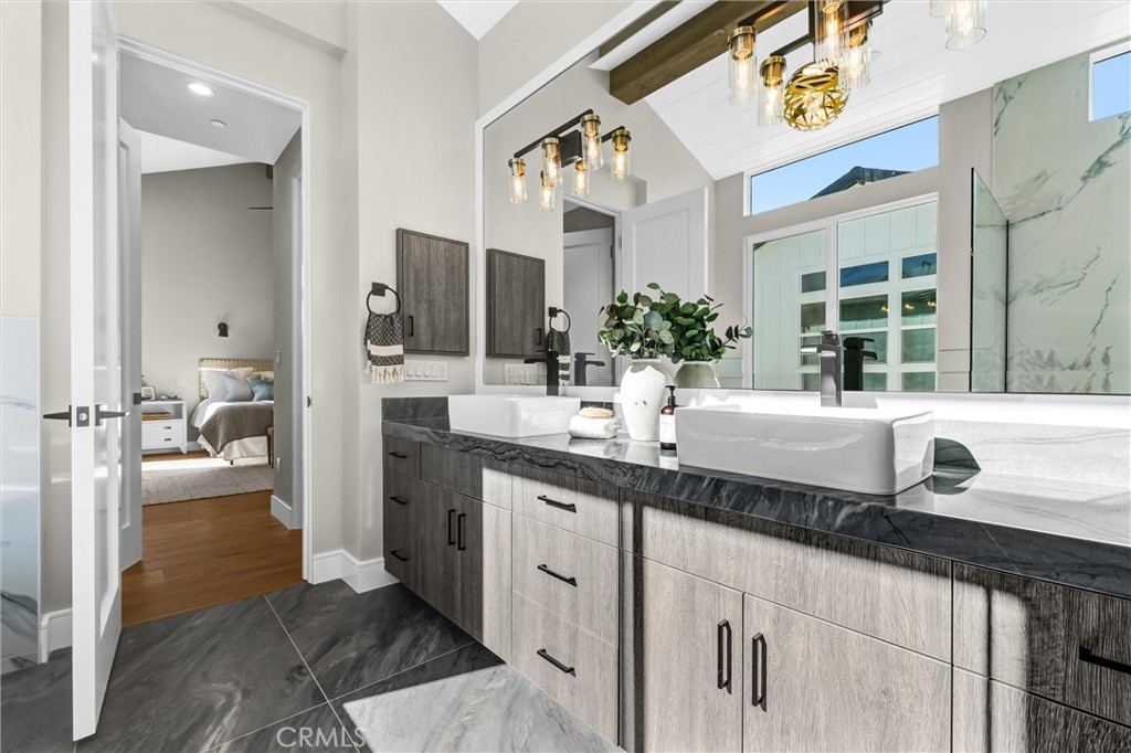 2016 Farrell Avenue, Unit A Redondo Beach, CA 90278 - Photo 26 of 42 a bathroom with a granite countertop sink and a mirror