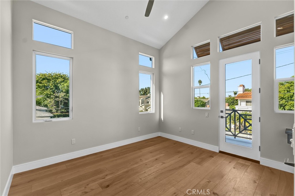 2016 Farrell Avenue, Unit A Redondo Beach, CA 90278 - Photo 33 of 42 a view of an empty room with wooden floor and a window