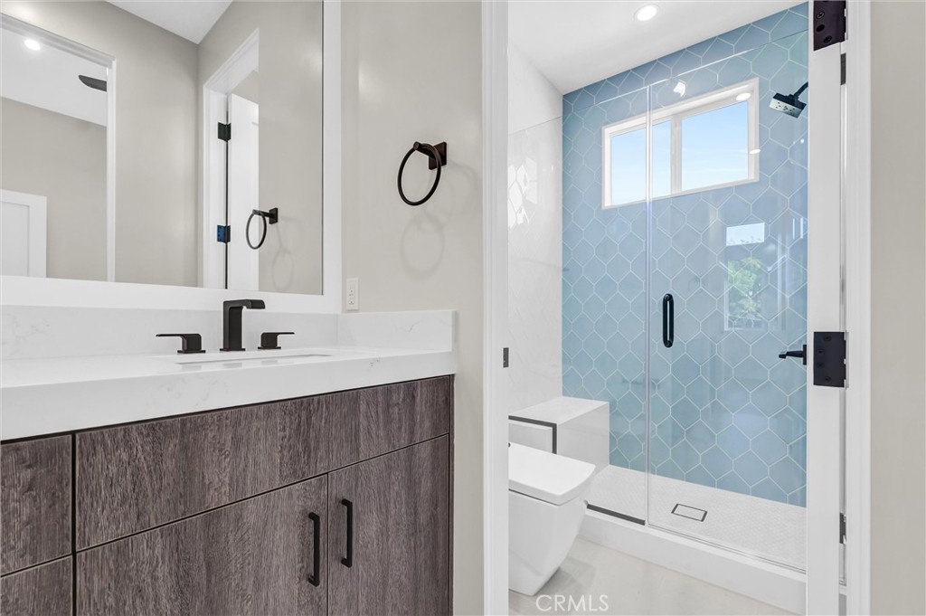 2016 Farrell Avenue, Unit A Redondo Beach, CA 90278 - Photo 35 of 42 a bathroom with a sink a toilet a mirror and shower