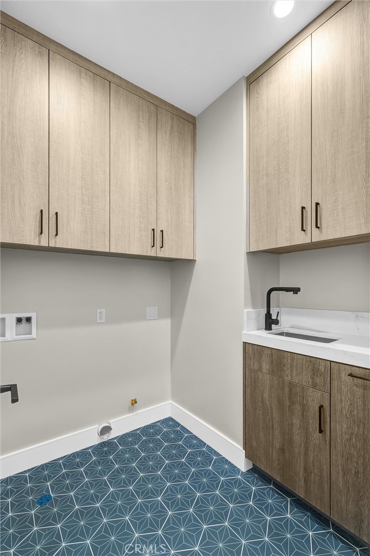 2016 Farrell Avenue, Unit A Redondo Beach, CA 90278 - Photo 37 of 42 a kitchen with granite countertop white cabinets and sink